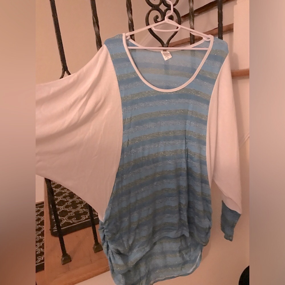 NWOT. Raglan sleeve. Light blouse. Longer in the back. Multiple sizes available